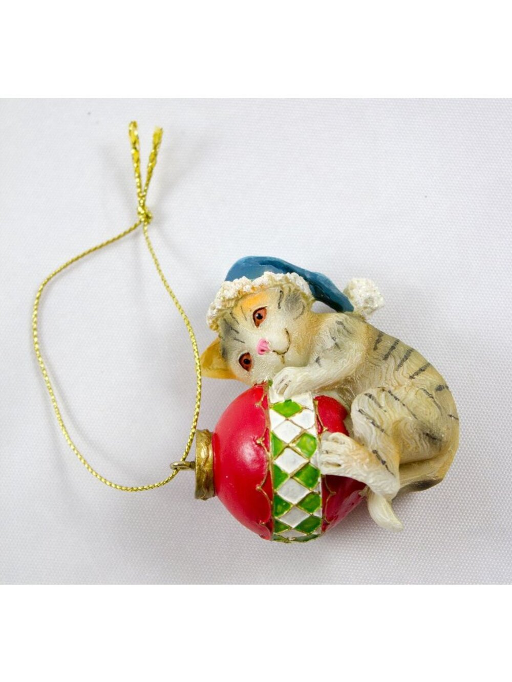 Cat Christmas Ornament With Blue Santa Hat Hugging Red & Green Bauble 2.5"